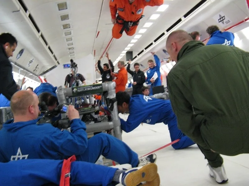 Parabolic-flight cabin with research team, equipment and filming crew